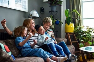 a group of people sitting on a couch a group of people sitting on a couch