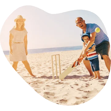 Family playing in the sand on the beach