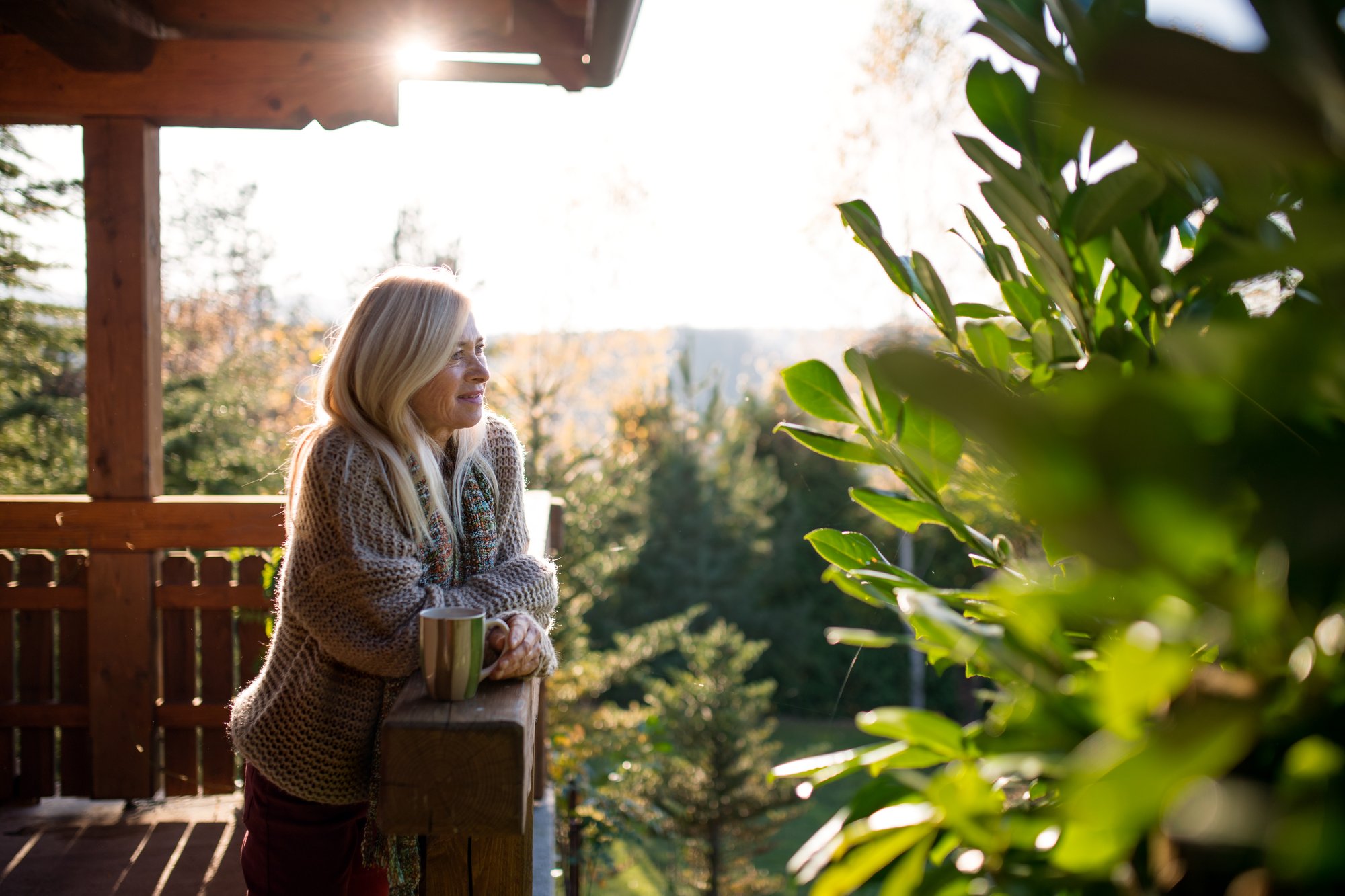 Woman looking off her porch
