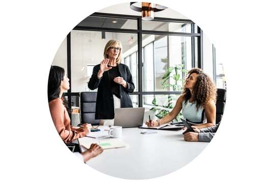 Woman standing in boardroom Woman standing in boardroom