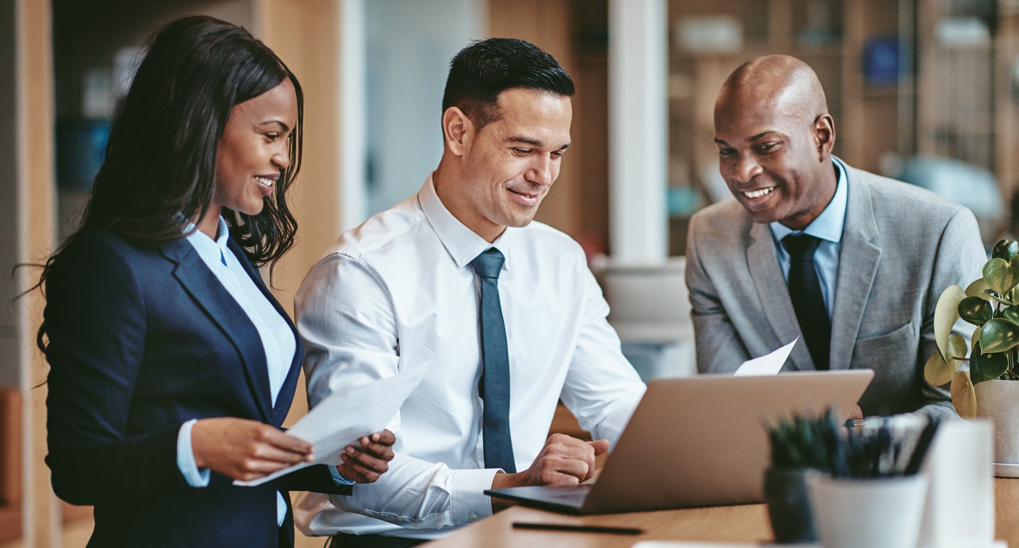 professionals-collaborating-on-a-laptop-in-an-offi-2026-03-09-04-59-25-utc