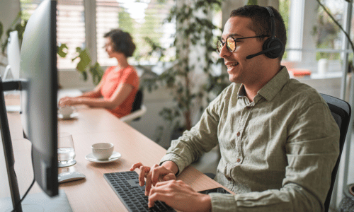 Customer service worker on phone and computer