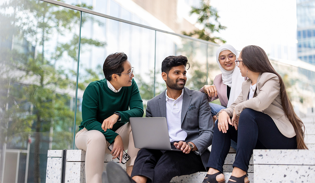 Employees sitting and talking outdoors-1