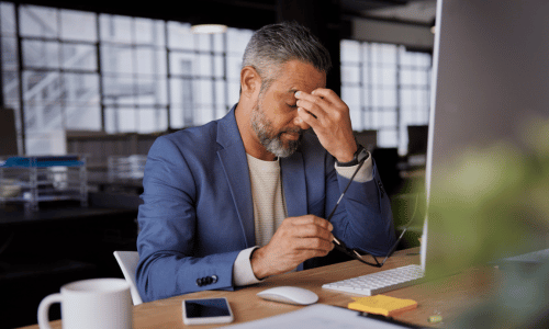 Man dealing with stress at work