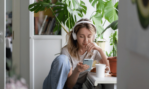 Woman with headphones on phone